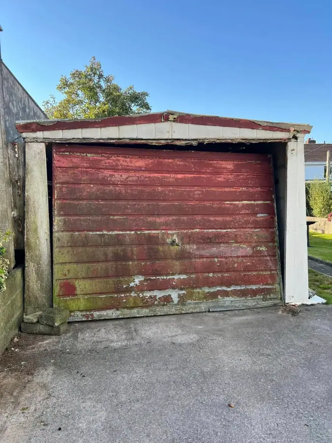 Old red timber garage door